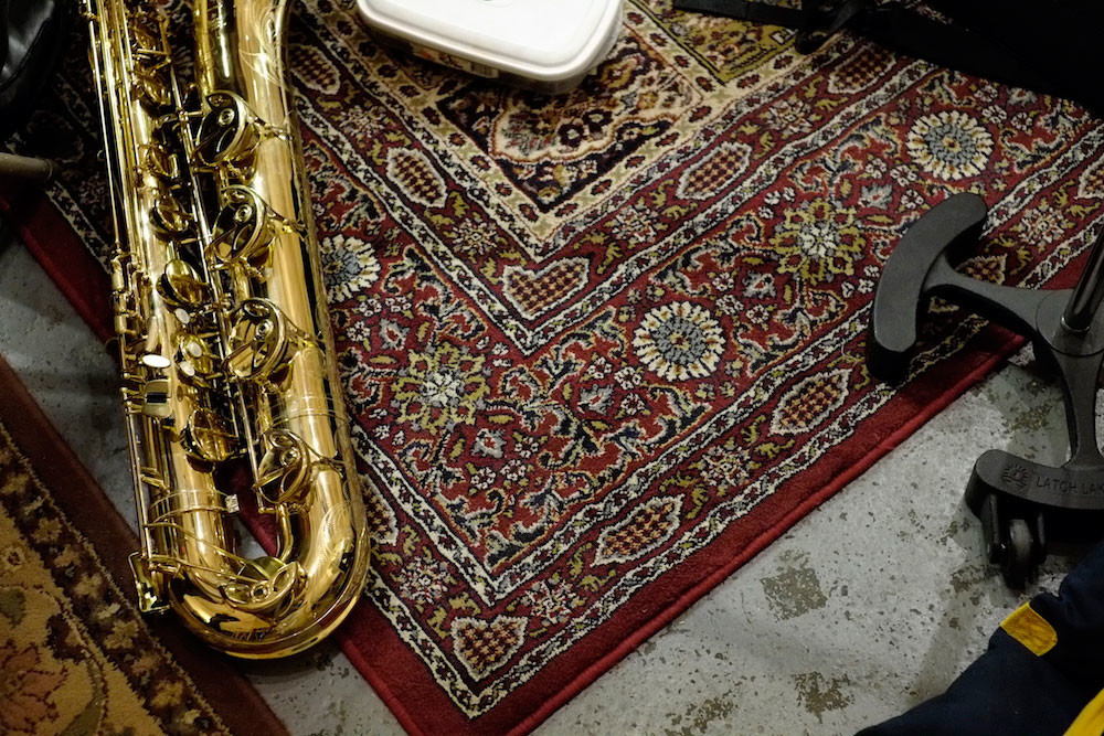Closeup of saxophone on rug